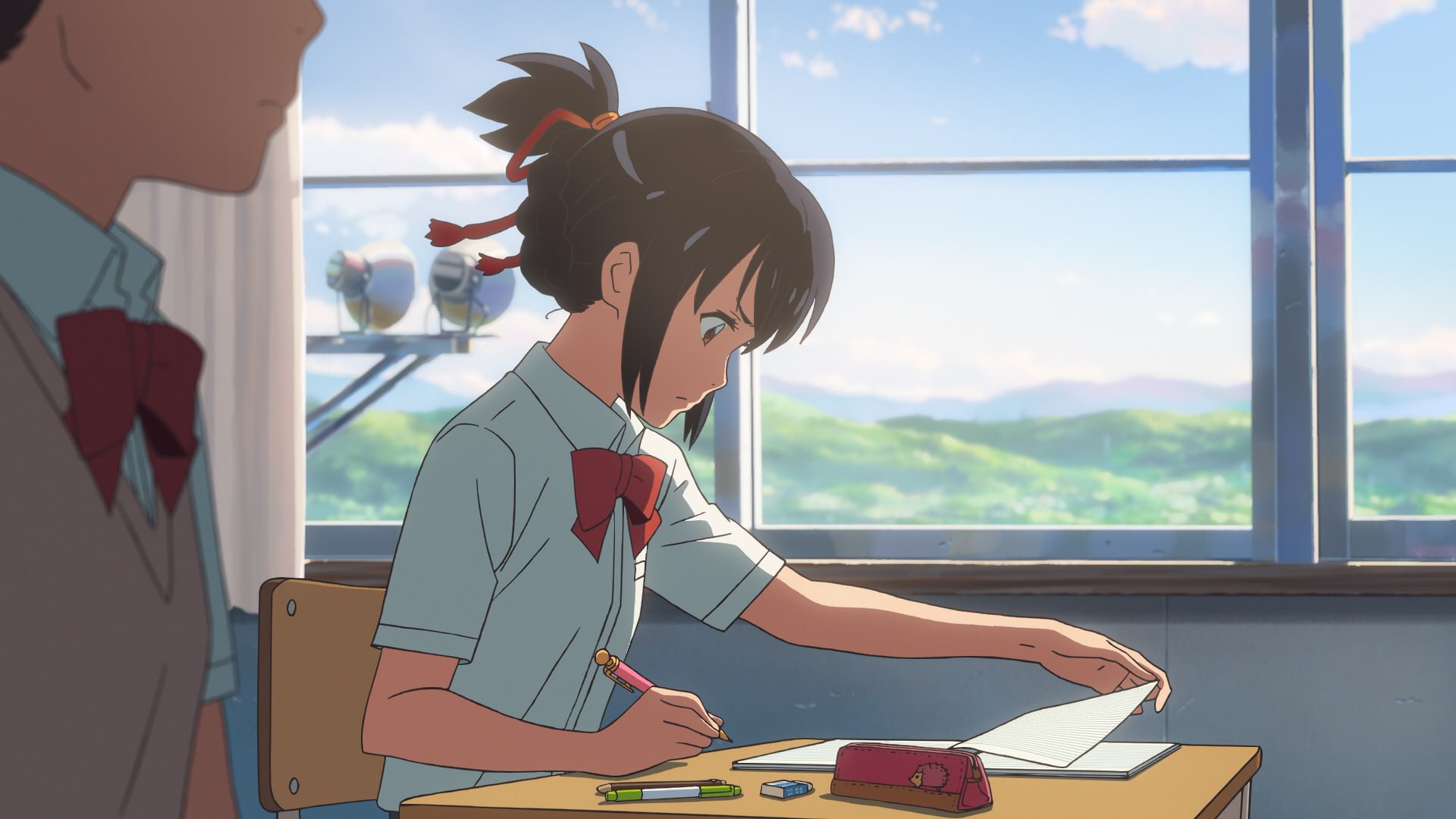 anime character doing homework